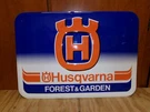 Vintage Nos Husqvarna Forest & Garden Embossed Sign Chainsaw. Fixed Price $199.00.