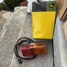 John Deere Tail Light Part #: AM126082. Fixed Price $50.00.