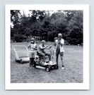 Photo Children Riding Lawn Mower Grandpa Camera 1950S Backyard Candid 3" X. Fixed Price $8.00.